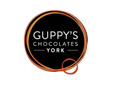 Guppy's Chocolates York brand logo