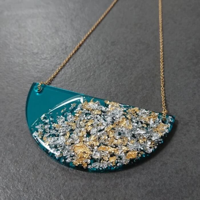 Image of Handmade Teal Mirror Half Moon Necklace made in the UK by RedApple. Buying this product supports a UK business, jobs and the local community