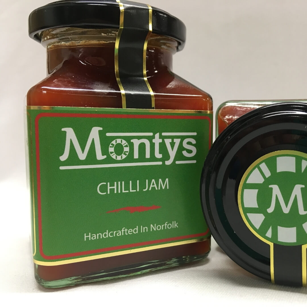 Image of Montys Chilli Jam made in the UK by Essence Foods. Buying this product supports a UK business, jobs and the local community