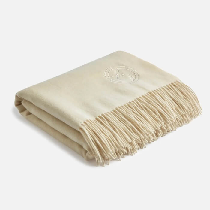 Image of Cream Wool Throw made in the UK by ESPA. Buying this product supports a UK business, jobs and the local community