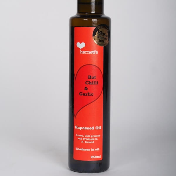 Image of Harnett’s Flavoured Rapeseed Oil made in the UK by Harnett’s Oils. Buying this product supports a UK business, jobs and the local community