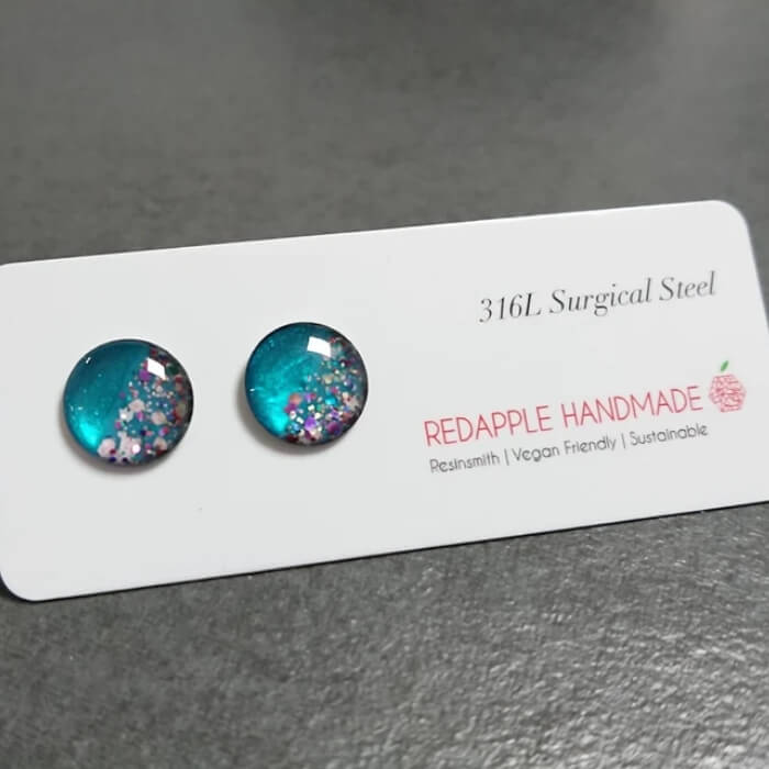 Image of Handmade Turquoise Galaxy Stud Earrings by RedApple, designed, produced or made in the UK. Buying this product supports a UK business, jobs and the local community.