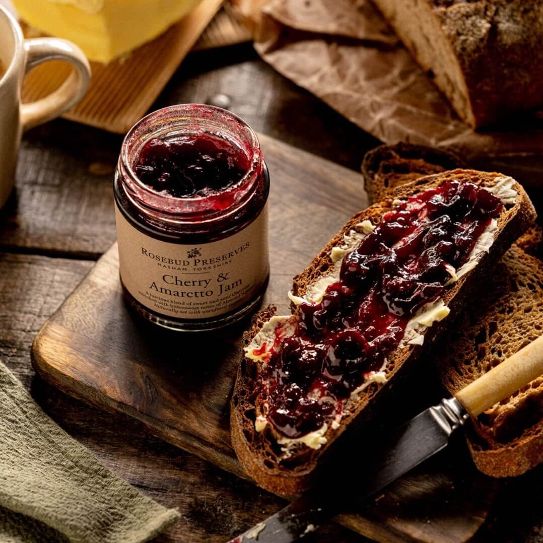Image of Cherry & Amaretto Jam made in the UK by Rosebud Preserves. Buying this product supports a UK business, jobs and the local community