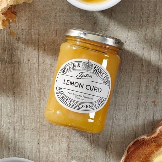 Image of Tiptree Lemon Curd by Wilkin & Sons, designed, produced or made in the UK. Buying this product supports a UK business, jobs and the local community.