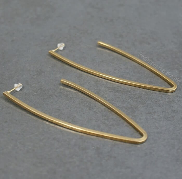 Image of Handmade Gold Arc Earrings made in the UK by RedApple. Buying this product supports a UK business, jobs and the local community
